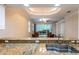 Modern kitchen featuring granite countertops and stainless steel sink, open to dining area at 21209 Diamonte Dr, Land O Lakes, FL 34637