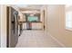 The open kitchen features stainless steel appliances, abundant cabinetry, and seamless flow to the living spaces at 21209 Diamonte Dr, Land O Lakes, FL 34637