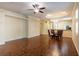 Spacious living room with hardwood floors, tray ceiling, and view to the kitchen at 21209 Diamonte Dr, Land O Lakes, FL 34637