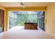 View of the covered and screened-in patio with hot tub overlooking a serene backyard at 21209 Diamonte Dr, Land O Lakes, FL 34637