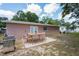 Backyard patio with outdoor dining and stainless steel grill at 2121 23Rd Sw St, Largo, FL 33774