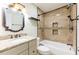 Bathroom features decorative tiles, vanity with marble countertop, and tub with bronze fixtures at 2121 23Rd Sw St, Largo, FL 33774