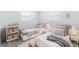 Charming bedroom with two twin beds, neutral bedding, and bright natural light at 2121 23Rd Sw St, Largo, FL 33774