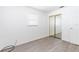 The bedroom includes modern floors and a mirrored closet door at 2121 23Rd Sw St, Largo, FL 33774