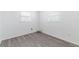 This bedroom features bright natural light from the window, with sleek modern floors at 2121 23Rd Sw St, Largo, FL 33774