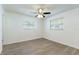 Spacious bedroom with neutral paint, modern ceiling fan, and light-colored flooring at 2121 23Rd Sw St, Largo, FL 33774