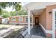 Inviting front porch with detailed entry door and classic white pillars at 2121 23Rd Sw St, Largo, FL 33774