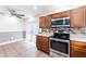The kitchen boasts stainless steel appliances, with a microwave above the stove at 2121 23Rd Sw St, Largo, FL 33774