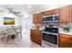 The kitchen area offers a dining table and stainless-steel appliances, perfect for Gathering gatherings at 2121 23Rd Sw St, Largo, FL 33774