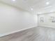 Bright living room with sleek, light-colored wood flooring and recessed lighting for a modern feel at 2121 23Rd Sw St, Largo, FL 33774