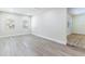 Bright living room featuring sleek floors, complemented by natural light from the windows at 2121 23Rd Sw St, Largo, FL 33774