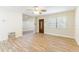 Open living area with wood-look tile, window, and detailed front door at 2121 23Rd Sw St, Largo, FL 33774