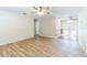 Bright living room featuring wood-look tile flooring, ceiling fan, and neutral paint at 2121 23Rd Sw St, Largo, FL 33774