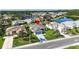 Aerial view of home in a lakeside community with mature landscaping and manicured lawns at 2227 North Creek Ct, Sun City Center, FL 33573