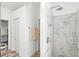 The primary bathroom includes a glass door shower with marble tile and a built-in shelf at 2227 North Creek Ct, Sun City Center, FL 33573