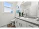 Bathroom with neutral tones, a single sink vanity, and shower at 2227 North Creek Ct, Sun City Center, FL 33573