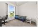 Bedroom with a large window letting in natural light and views of the backyard at 2227 North Creek Ct, Sun City Center, FL 33573