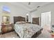 Comfortable bedroom with neutral carpet, and a dark wood dresser and furnishings at 2227 North Creek Ct, Sun City Center, FL 33573
