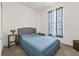 Bedroom with a cozy bed, side table, and a window at 2227 North Creek Ct, Sun City Center, FL 33573