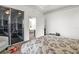 This bedroom includes a door to another room, a ceiling fan, and a comfortable chair at 2227 North Creek Ct, Sun City Center, FL 33573