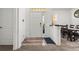 Bright foyer featuring wood-look flooring, a glass front door, sidelight and an adjacent dining area at 2227 North Creek Ct, Sun City Center, FL 33573