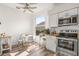 Eat-in kitchen featuring stainless steel appliances, and a window with a view of the backyard at 2227 North Creek Ct, Sun City Center, FL 33573