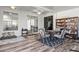 Living room features a dining area, comfortable seating and sliding door access to the exterior at 2227 North Creek Ct, Sun City Center, FL 33573
