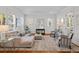 Inviting living room featuring a comfortable sectional, stylish decor, and abundant natural light at 2603 Sanders Dr, Tampa, FL 33611