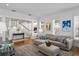 Cozy living room featuring a plush sectional, stylish decor, and bright natural light at 2603 Sanders Dr, Tampa, FL 33611