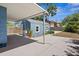 Full backyard showing a blue shed, outdoor work area, landscaping and the home itself at 2720 14Th N Ave, St Petersburg, FL 33713