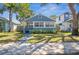 Charming blue bungalow with manicured lawn and a welcoming front porch at 2720 14Th N Ave, St Petersburg, FL 33713