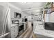 Open concept kitchen featuring stainless steel appliances, marble countertops, decorative backsplash, and an open flow at 2720 14Th N Ave, St Petersburg, FL 33713