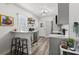 Charming kitchen with breakfast bar, stainless steel appliances, decorative backsplash, and modern finishes at 2720 14Th N Ave, St Petersburg, FL 33713