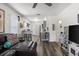 Spacious living room with wood-look floors, modern decor, and open kitchen concept at 2720 14Th N Ave, St Petersburg, FL 33713