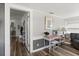 Cozy living room featuring wood-look floors, a desk, and doorway to the kitchen at 2720 14Th N Ave, St Petersburg, FL 33713