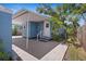Cozy outdoor area with a blue shed, a covered patio, and a stairway leading to the home's entrance at 2720 14Th N Ave, St Petersburg, FL 33713
