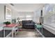 Bright sunroom featuring a cozy seating area, vintage desk, and natural light at 2720 14Th N Ave, St Petersburg, FL 33713