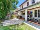Spacious backyard features an outdoor kitchen, covered seating, and a playful area at 3003 W Leila Ave, Tampa, FL 33611