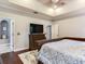 Bedroom with a ceiling fan, hardwood floors, walk-in closet, and ensuite bathroom at 3003 W Leila Ave, Tampa, FL 33611