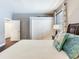 Bright bedroom featuring a comfortable bed, closet, and fresh white trim and doors at 3003 W Leila Ave, Tampa, FL 33611