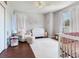 Cozy Bedroom with comfortable seating, a crib, changing table, and stylish decor at 3003 W Leila Ave, Tampa, FL 33611