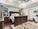 Spacious bedroom with tray ceilings, hardwood floors, and bright windows at 3003 W Leila Ave, Tampa, FL 33611