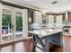 Bright, renovated kitchen with island, stainless appliances, and view to the patio at 3003 W Leila Ave, Tampa, FL 33611