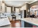 Bright kitchen with stainless steel appliances, gray backsplash, and view of dining room at 3003 W Leila Ave, Tampa, FL 33611