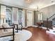 Inviting living area with hardwood floors, arched windows, and staircase at 3003 W Leila Ave, Tampa, FL 33611