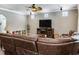 Comfortable living room with plush sectional couch and ceiling fan at 3003 W Leila Ave, Tampa, FL 33611