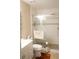 Modern bathroom with a tiled shower, a sleek vanity, and stylish fixtures at 311 Kelsey Way # 3, Sun City Center, FL 33573