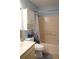 Compact bathroom featuring a vanity, toilet, and a shower/tub combo with a curtain at 311 Kelsey Way # 3, Sun City Center, FL 33573