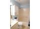 Cozy bathroom featuring a shower-tub combo, white sink vanity, toilet, and ample lighting at 311 Kelsey Way # 3, Sun City Center, FL 33573