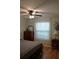 Comfortable bedroom with warm lighting, hardwood floors, and a serene atmosphere at 311 Kelsey Way # 3, Sun City Center, FL 33573